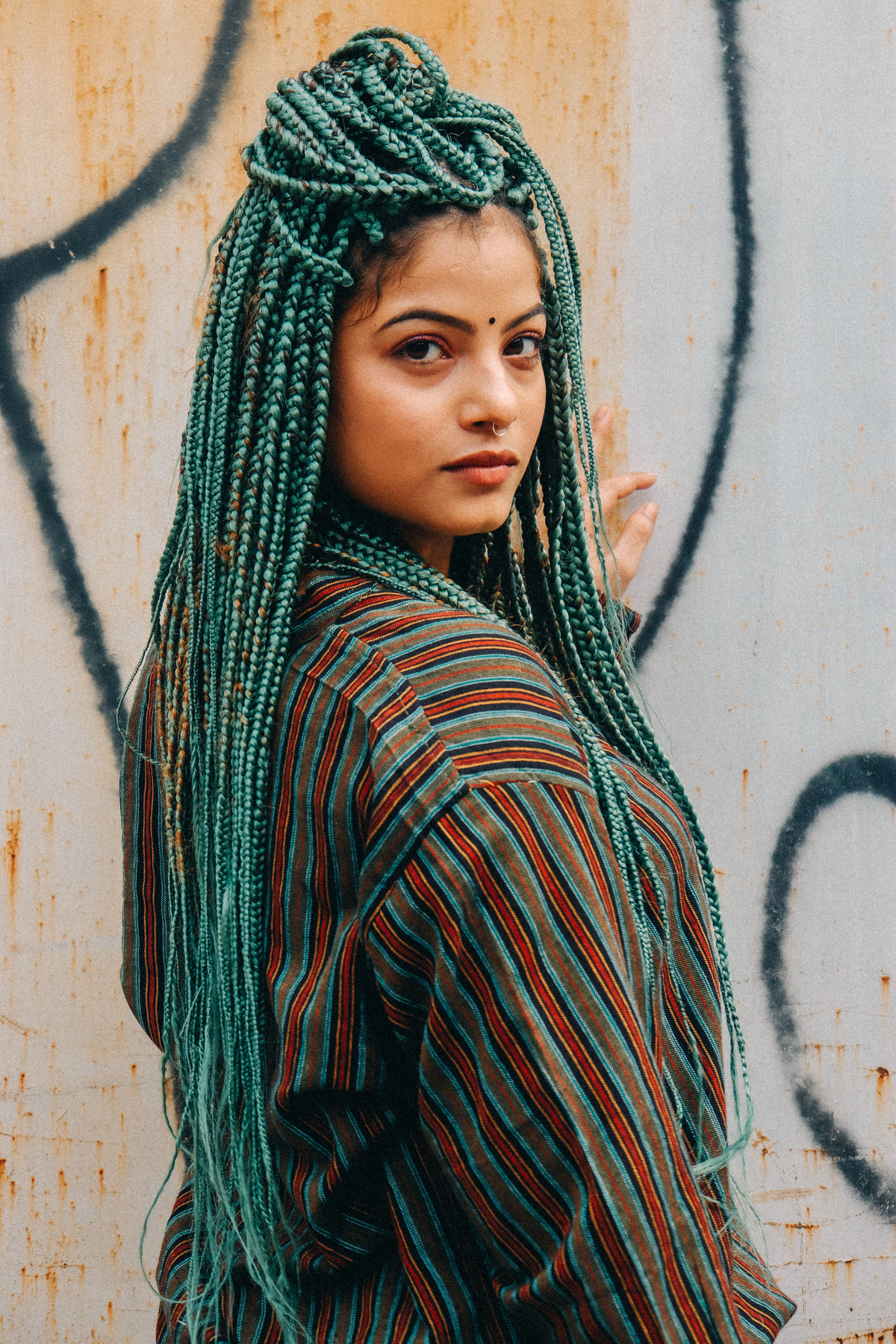 Young Woman with Many Long Green Coloured Braids